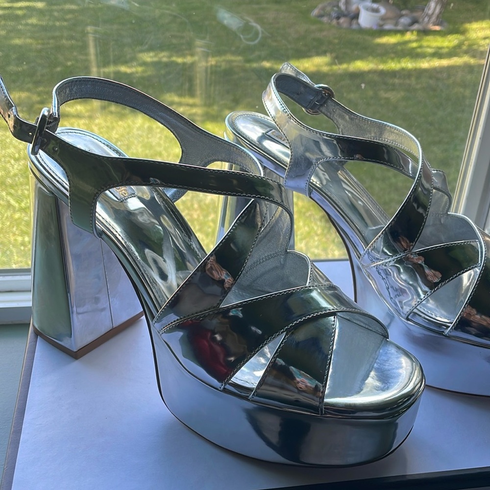 New never worn Larroude silver platforms